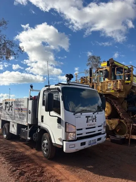 tph-dozer The Pilbara Hub field-service truck beside a tracked dozer