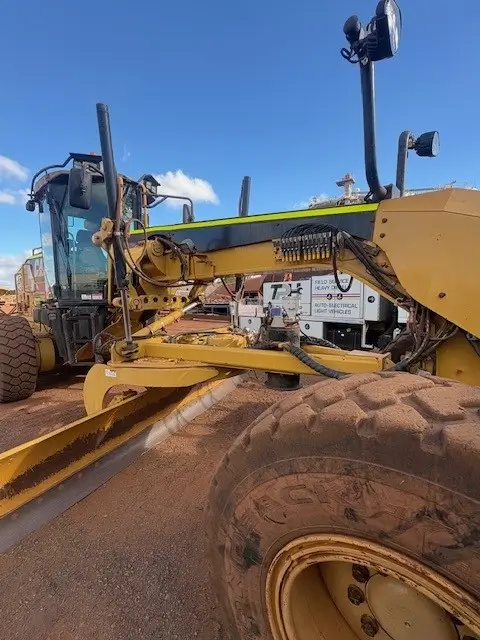 The Pilbara Hub field-service truck beside a grader